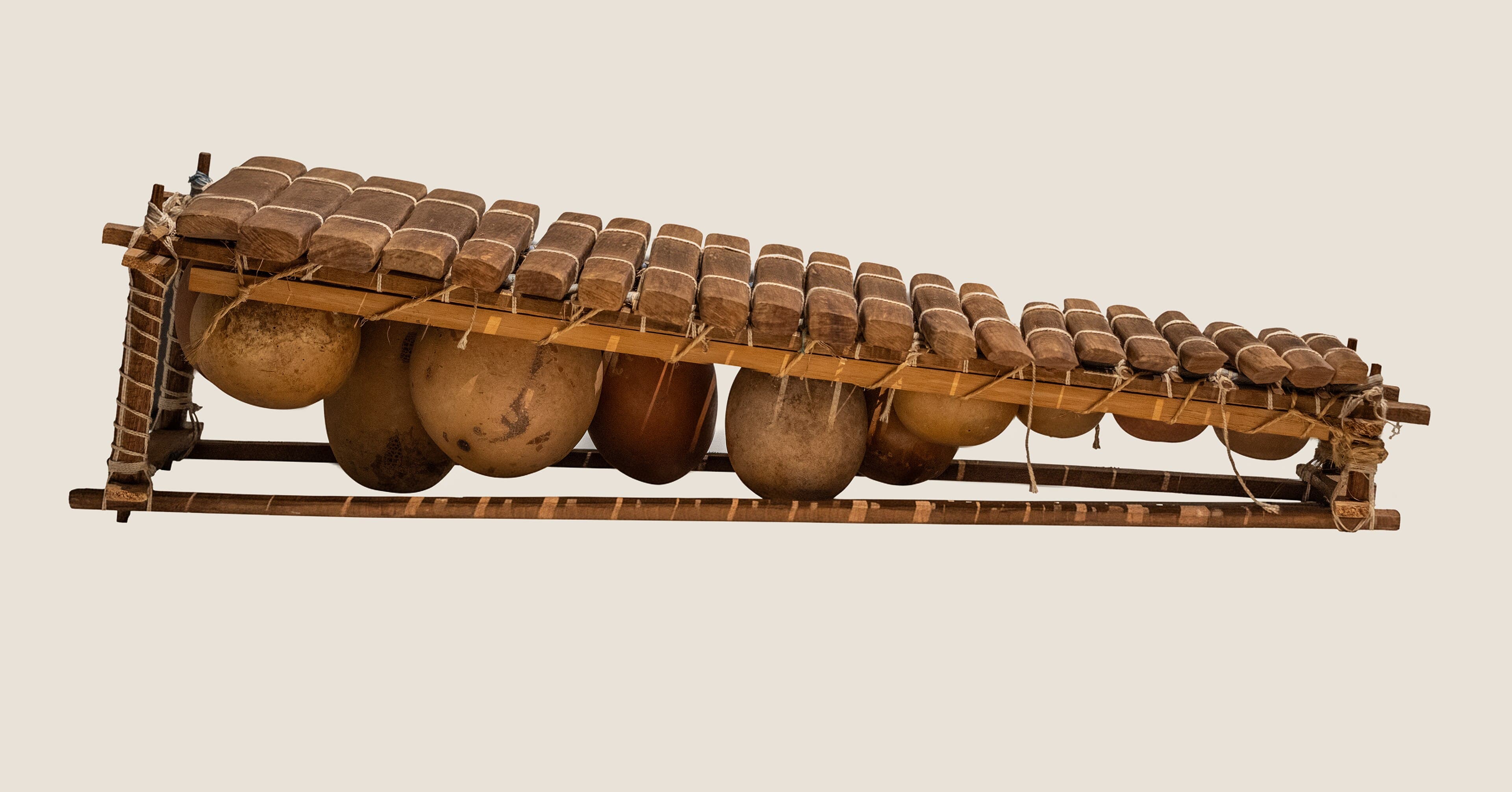 A musician playing the balafon - a large wooden xylophone with gourd resonators