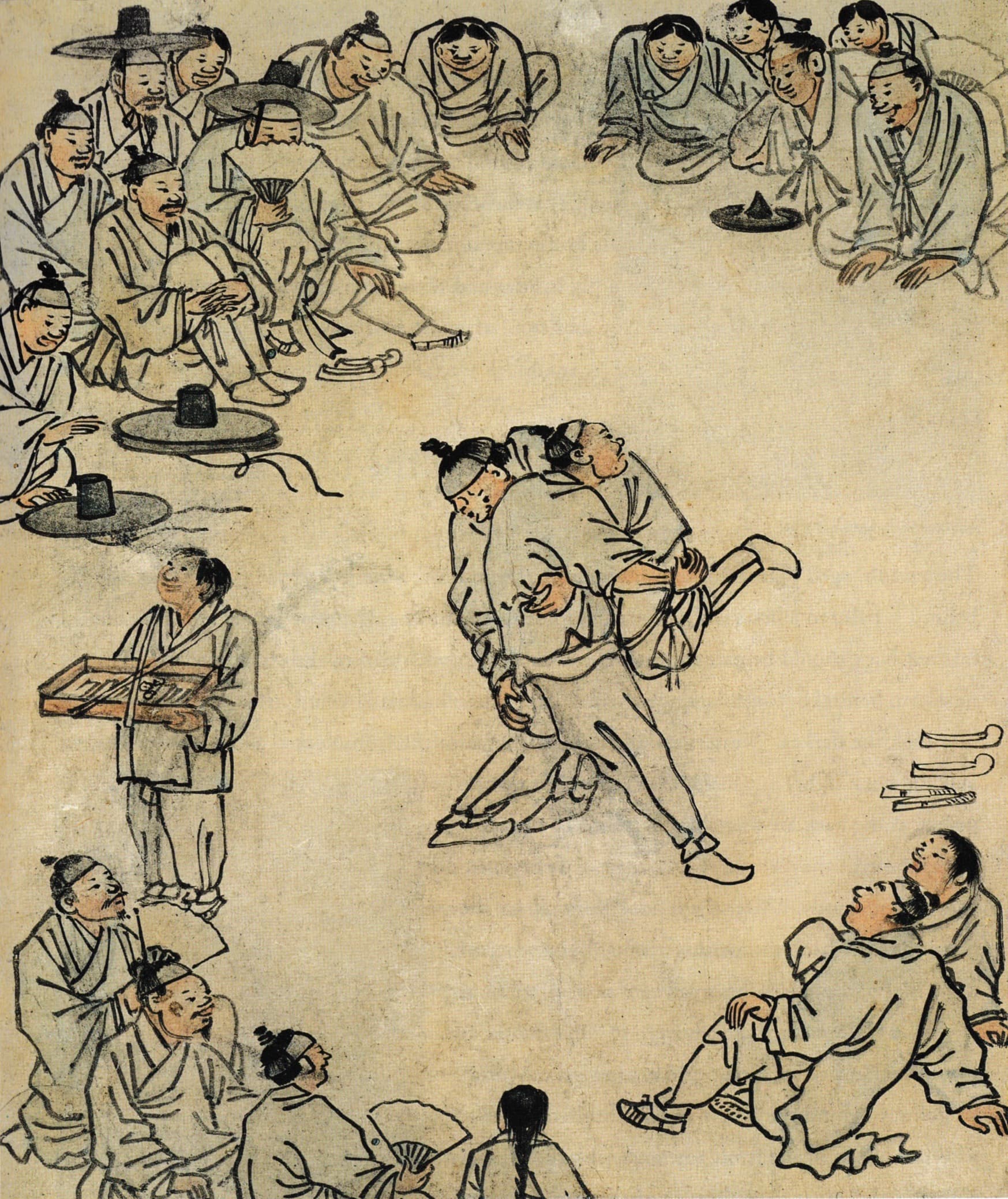 Two wrestlers in traditional Korean white outfits gripping each other's coloured sashes in a sandy ring