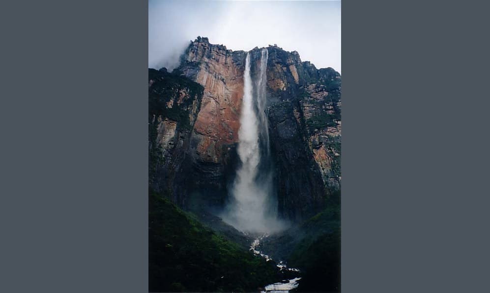 Angel Falls tumbling down the side of a flat-topped mountain in the Venezuelan jungle